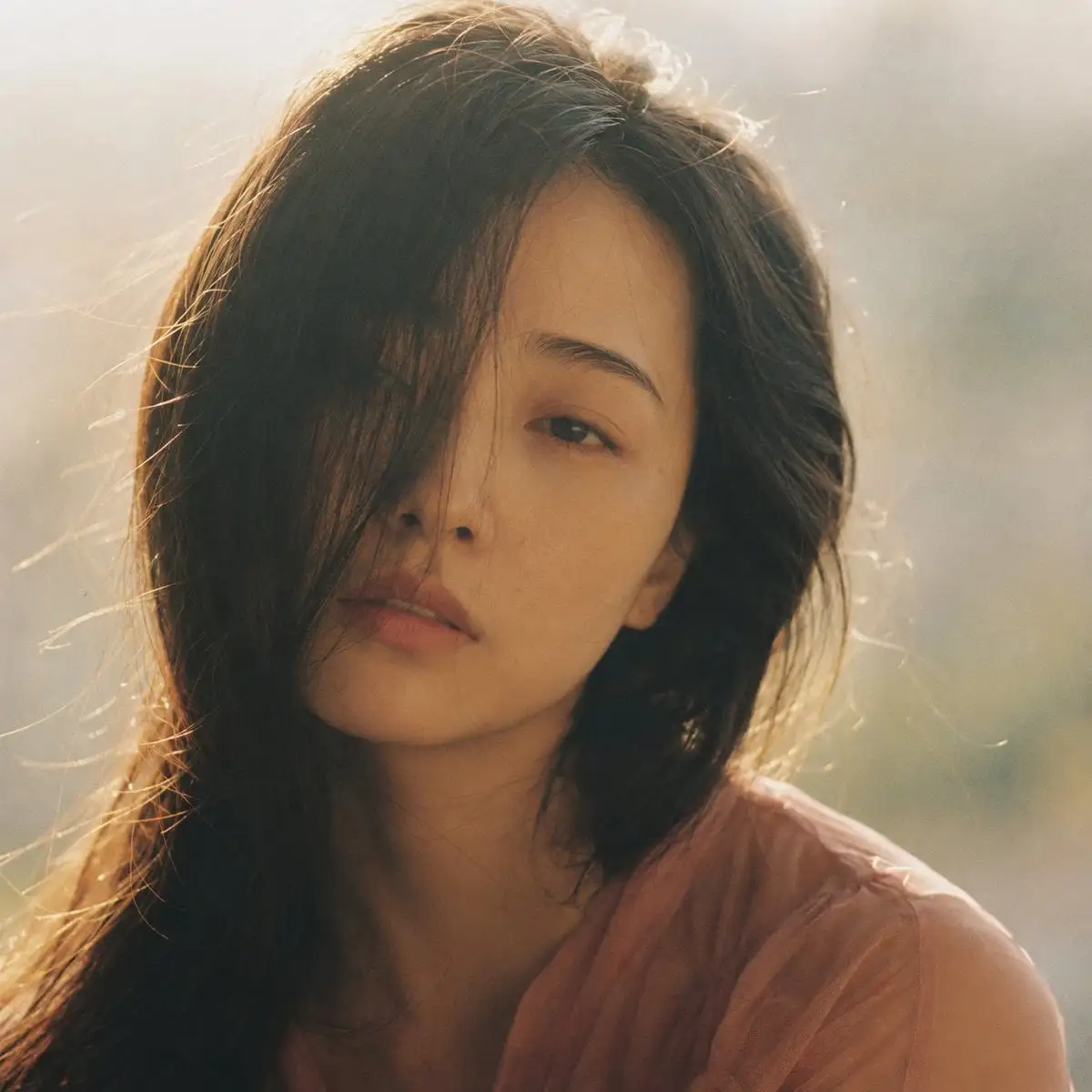 Portrait shot on 85mm f/1.4, square crop close-up of a Ja...