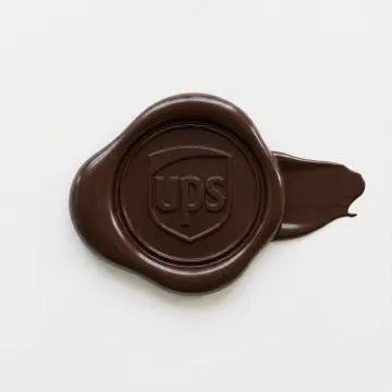 [MATERIAL COLOR] glossy wax seal icon depicting [BRAND] logo, lying flat on a plain white background. The seal is made of thick, deformed plastic or wax with an irregular, squashed shape and a prominent 'drip' or smear extending to the right side. The center features a clear, raised relief impression of the subject. The lighting is soft and even, creating smooth specular highlights on the curved, glossy edges. The shadow cast is soft and minimal.